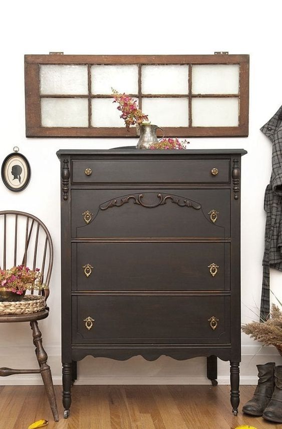 a black vintage dresser with vintage handles is a lovely idea for a farmhouse space, it can be rocked in an entryway, living room or bedroom