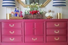 a bold pink vintage dresser will be a bold addition of color and a cool storage unit in a neutral or colorful space