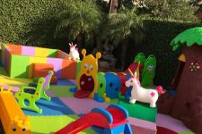 a colorful and fun kids’ playspace with various toys, slides, a ball box and a mini playhouse is a cool idea for any outdoors