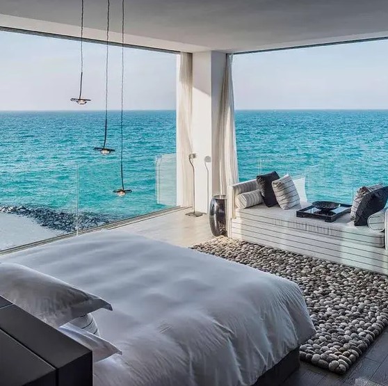 a couple of floor to ceiling windows is sure to make your room wow if the view is cool, like here - a fantastic sea and coast view