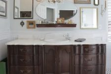 a dark-stained vintage dresser with a white countertop and a sink, a vintage faucet is a beautiful idea for a bathroom