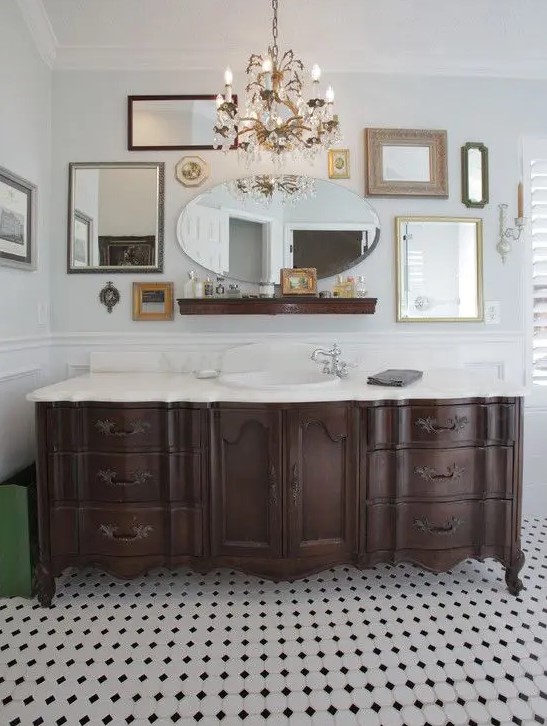 a dark-stained vintage dresser with a white countertop and a sink, a vintage faucet is a beautiful idea for a bathroom