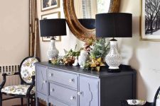 a midnight blue vintage dresser with table lamps, potted greenery and succulents, 3D stars is a beautiful decor idea