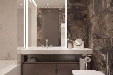 a minimalist bathroom with brown marble tiles, white appliances and stone surfaces is super chic