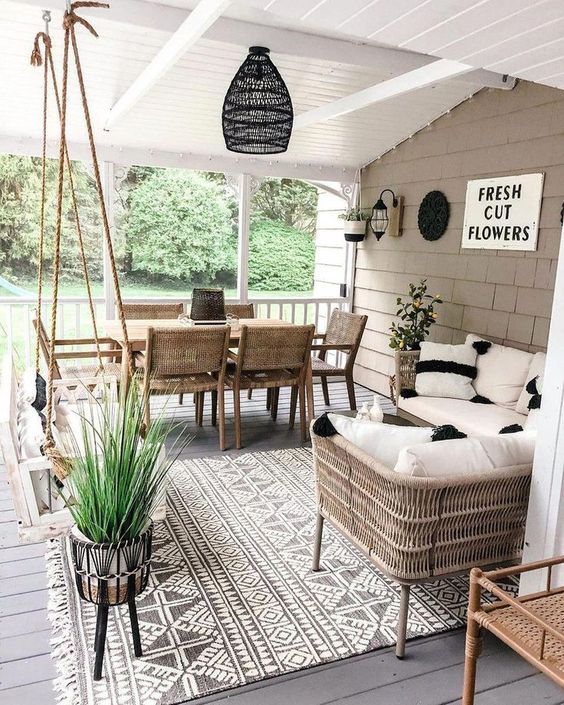 a cool terrace with a hanging daybed