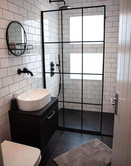 a lovely bathroom with a window in a shower