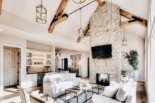 a cozy living room with wooden beams