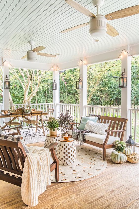 a lovely rustic terrace with fall decor