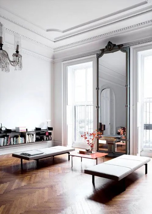 gorgeous floor to ceiling windows give amazing views, and a tall mirror enlarges the space even more