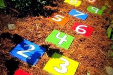 substitute usual stepping stones in the garden with bright numbers to let kids jump and learn numbers at the same time