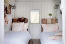 13 a cozy vintage-inspired guest bedroom with twin beds and wooden floors, walls and a ceiling