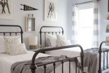 29 a neutral vintage guest bedroom with two metal beds and touches of vintage here and there is lovely