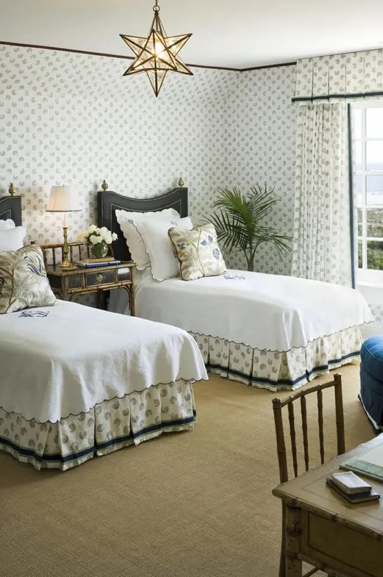 an art deco styled guest bedroom with much pattern, geometric lamps and refined furniture