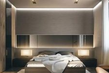 a beautiful contemporary bedroom done in elegant neutral tones, with several layers of light, a bed and matching sleek nightstands plus a long mirror
