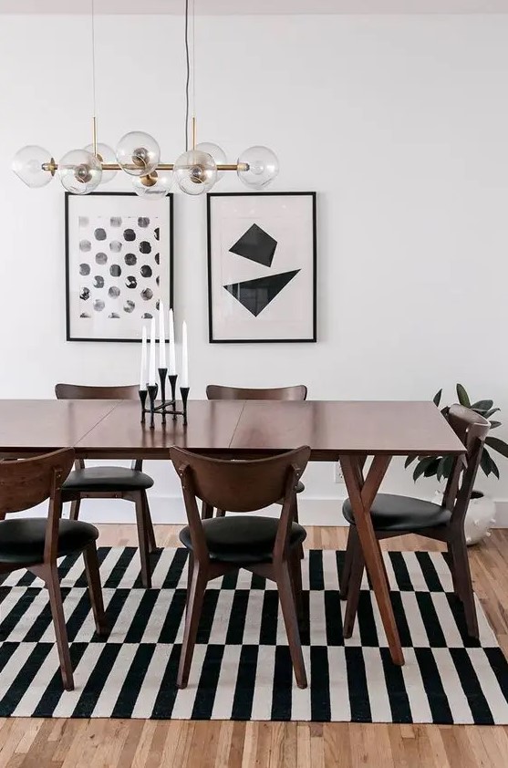 a trendy dining space with a gallery wall