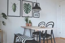 a dining space with a small gallery wall