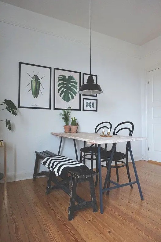 a dining space with a small gallery wall