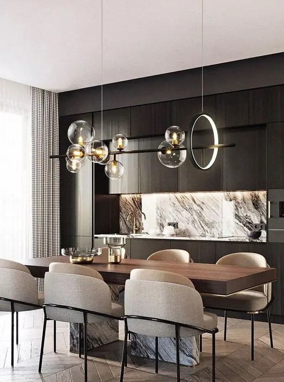 a refined contemporary dining space wiht a wood and marble table, neutral rounded chairs, a chic chandelier with a light circle