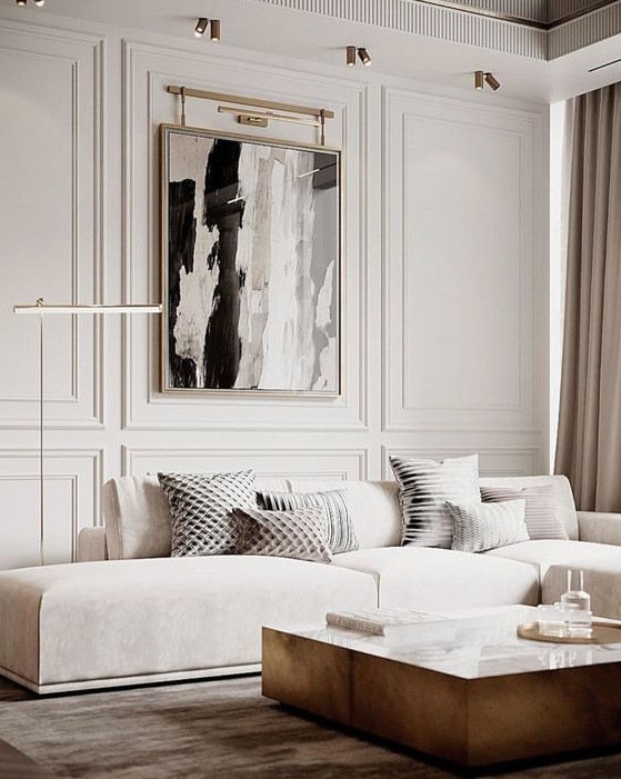 a refined contemporary living room with a low creamy sofa, a low table, a statement artwork and some lamps and lights