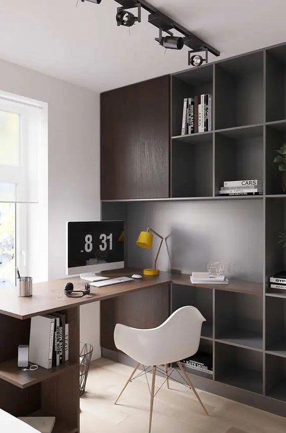 a simple contemporary home office with dark stained storage cabinets and a built-in desk plus open storage units, a white chair