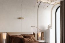 a sophisticated contemporary bedroom with a curved wall and built-in lights, an upholstered bed with rust bedding, a bench and catchy nightstands
