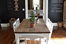 a dining room with a chalkboard wall