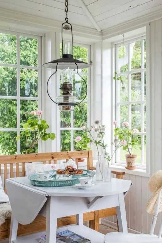 a cozy dining space with large windows