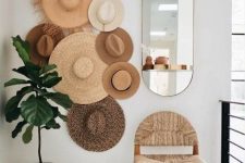 11 a hat gallery wall used as decor to add interest to a neutral boho space, it looks chic and lovely