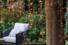 20 hanging LED lights can be placed on the trees to create whole curtains and canopies of light in your garden
