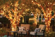 23 string lights covering the tree and hidden under the grasses give enough light to this cozy space