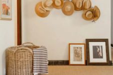 25 a whitewashed branch with hats attached to it, with ropes and pins is a beautiful arrangement for an entryway, great to add a Mediterranean touch to the space
