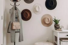 27 an entryway hat display with hooks on the walls that are hidden by the hats themselves is a lovely idea to add decorative value to the space
