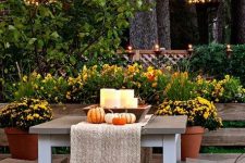 a lovely deck decorated for fall