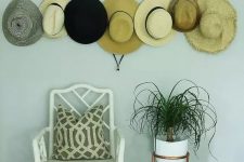 30 a copper hanger with hooks and pins is ideal to hold your hats, this is a pretty solution for an entryway or a closet