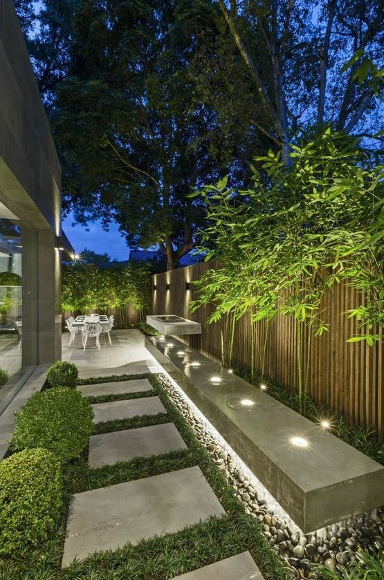 an outdoor space lit up with hidden lights, with built in lights looks modern, fresh and bold and is very lit up