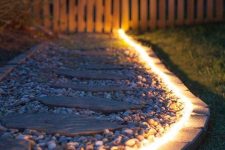 38 LED outdoor lights that frame the walkway are a great idea to illuminate your outdoor space in a delicate and modern way