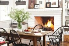 A lovely dining room with a brick fireplace