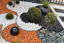 a catchy Japanese-inspired front yard garden with various rocks and pebbles, potted plants and mini trees is cool