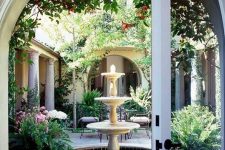 a classic tiered bowl fountain is always a great fit for a vintage-inspired bbackyard or just outdoor space