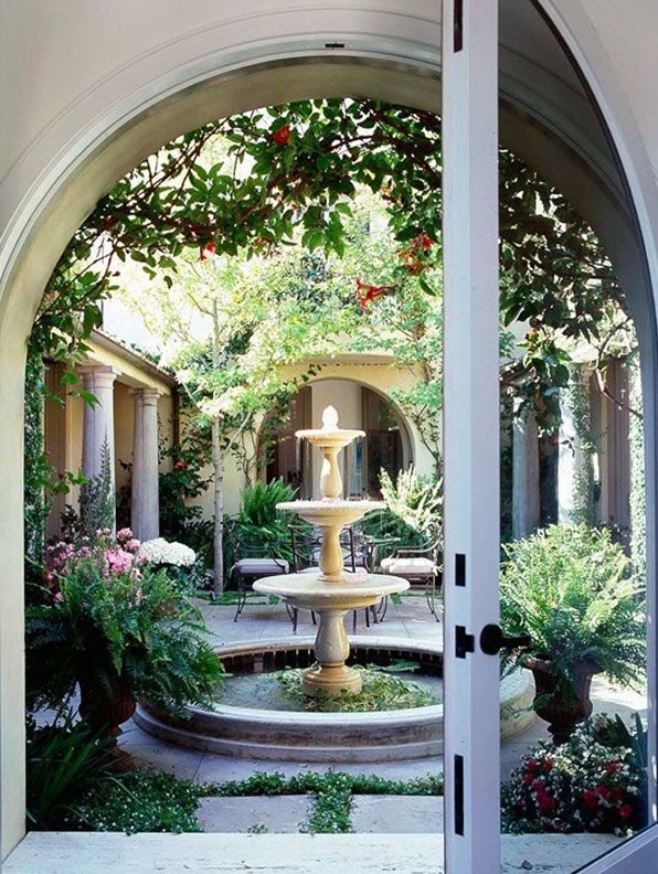 a classic tiered bowl fountain is always a great fit for a vintage-inspired bbackyard or just outdoor space