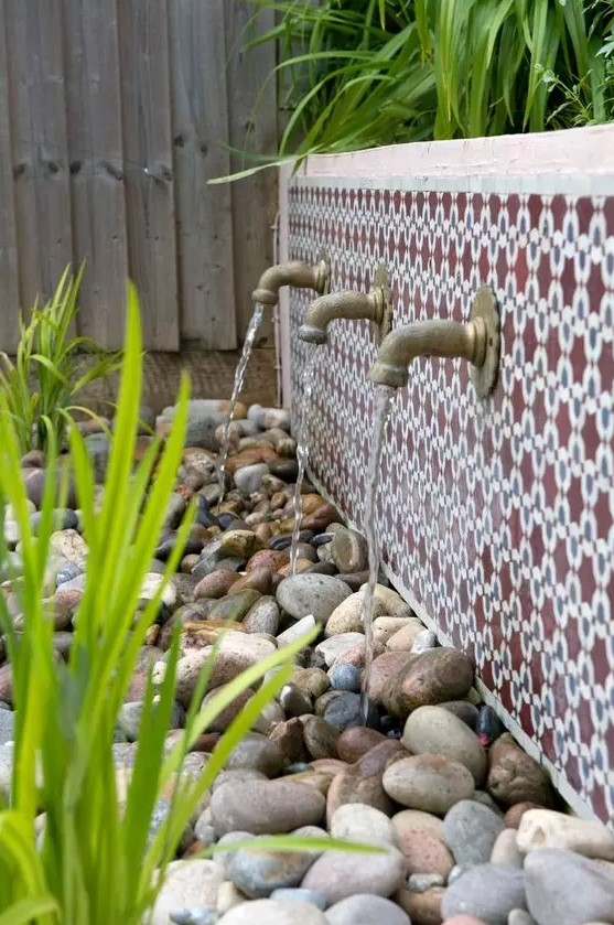a lovely outdoor fountain with Moroccan tiles