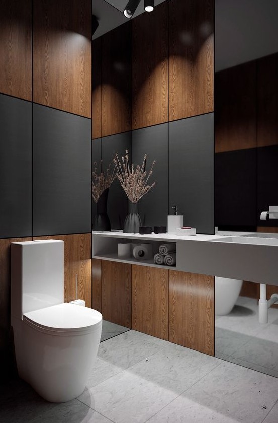 A contemporary powder room with plywood and black panels, a mirror, a concrete vanity and some built in lights