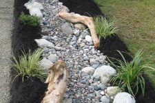 a lovely faux stream with driftwood
