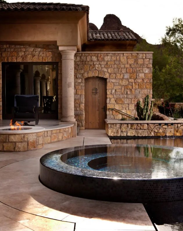 a cool backyard with a pool and a fire bowl