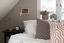 a cute neutral attic bedroom design