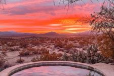 a magical place to take a dip in a hot tub with views of an unforgettable sunset in Joshua Tree, California