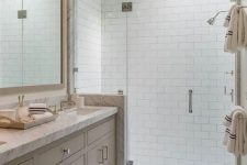 a neutral bathroom with subway tiles
