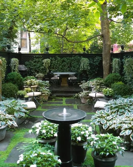 a small and classy stone pedestal fountain will be a great solution for any formal or vintage-inspired garden
