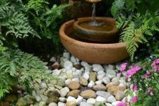 a small and delicate fountain of a porcelain vase and bowls is a lovely idea for a small garden – you get a fountain that doesn’t take much space
