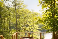 a wooden two-storey hot tub on a deck is the best choice if you want to enjoy surrounding views